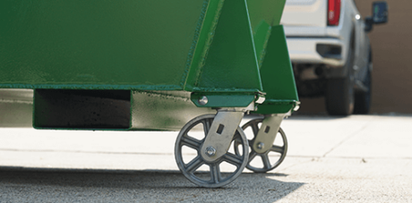 A hopper with casters on it