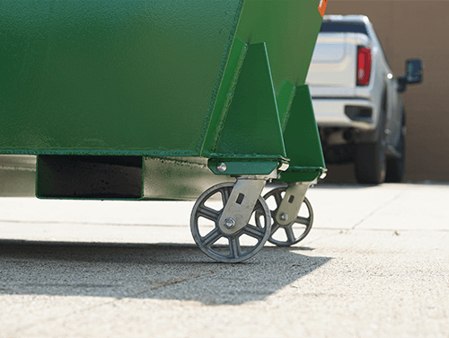 A hopper with casters on it