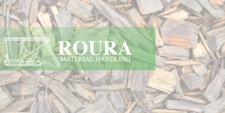Mulch chips overlayed with Roura's logo