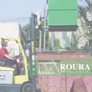 A forklift operator completely turning a rotator box 180 degrees over a container