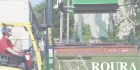 A forklift operator completely turning a rotator box 180 degrees over a container