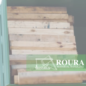 Wooden board/timber scrap is being dumped out of a rotator box