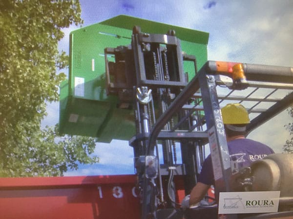 Dump hopper being lifted with a forklift