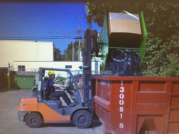 Using a forklift dump hopper