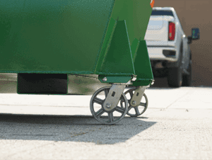 A hopper with casters on it