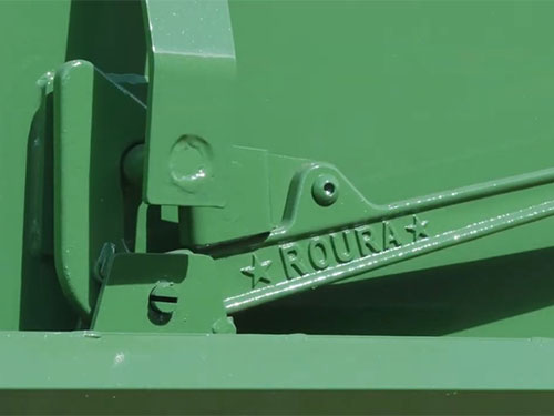 Latch release handle on one of Roura's self-dumping hoppers.