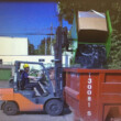 gaylord-hopper-rear-forklift-lifted-dumping-dumpster-side